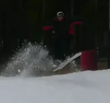 snowboard jump closeup 2.webp