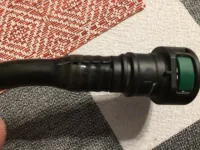 Cracked purge hose causing leak.webp