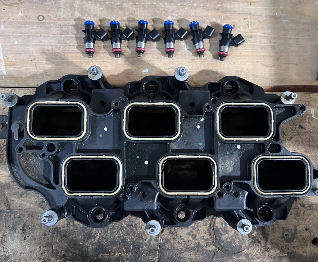 Old injectors out of upper intake